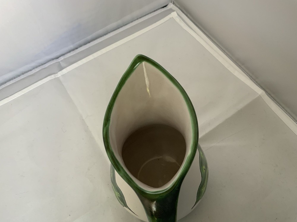 Small ceramic pitcher with floral design Signed