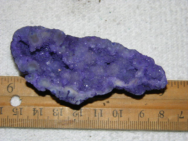 Geode cut & polished half with colored crystal center 3 inch E44