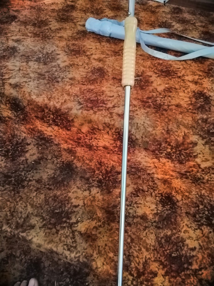 Golf umbrella with pole inside main pole for pushing into sand or soil, carrybag
