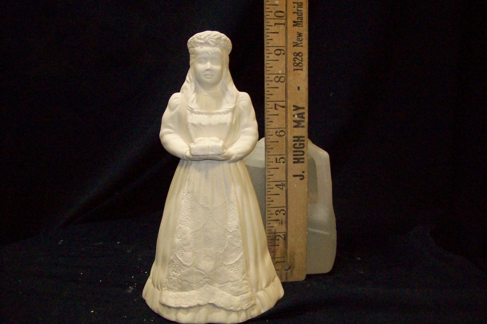 ceramic bisque ready to paint Ms Clause holdinga package
