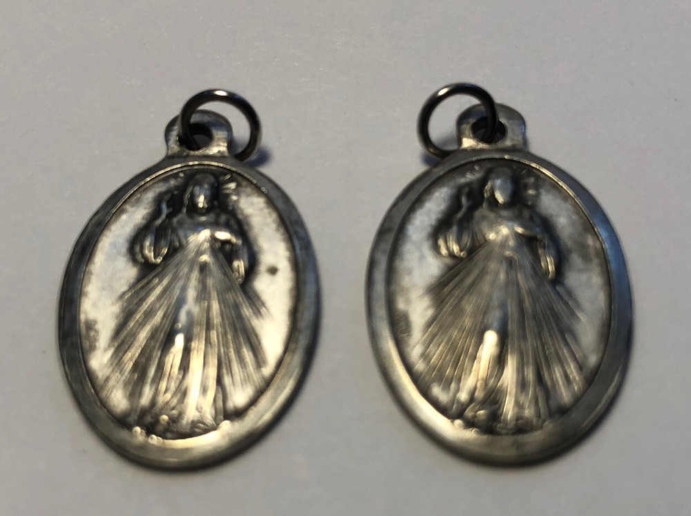 two vintage Religion Silvertone charm/pendant