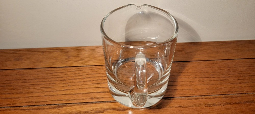 VINTAGE HAND BLOWN GLASS PITCHER WITH APPLIED HANDLE.