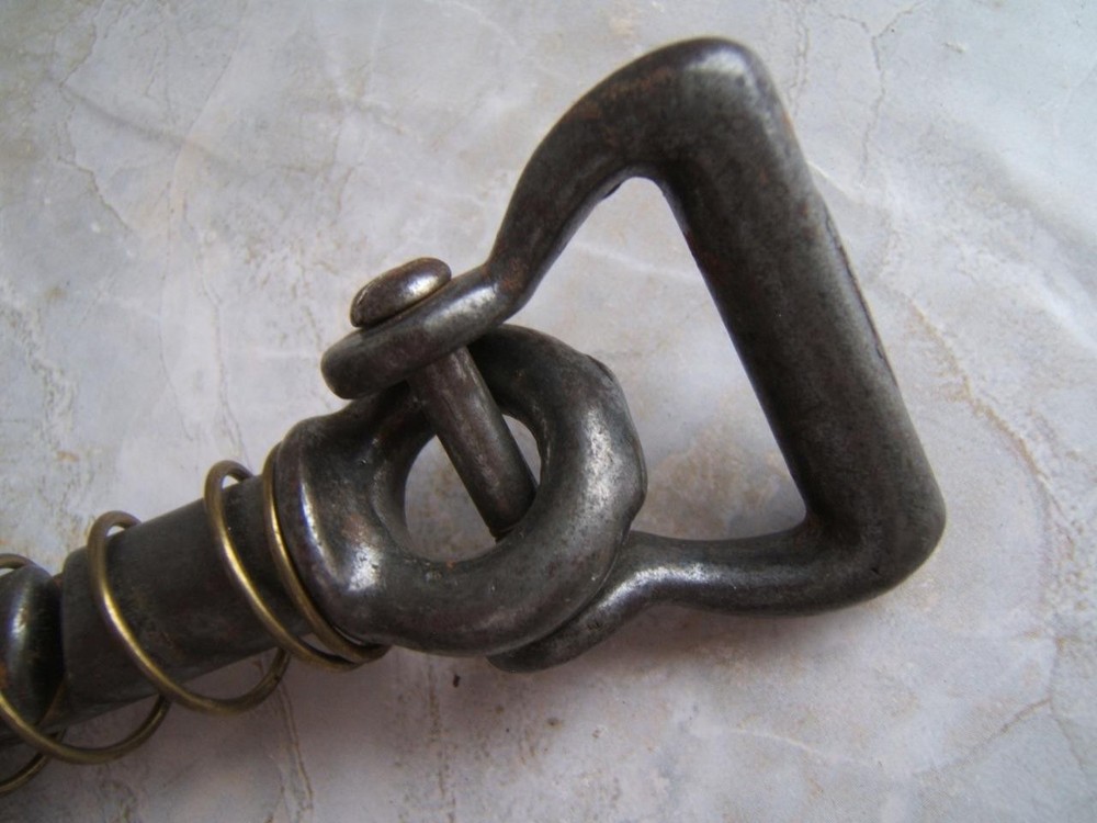 ANTIQUE SPRING-LOADED CAST-IRON BULL LEADING TOOL