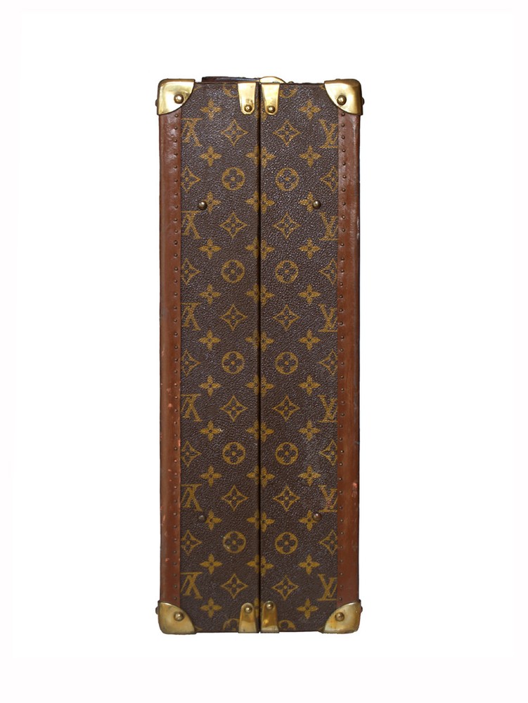 Louis Vuitton monogram suitcase trunk open by center, square handle.