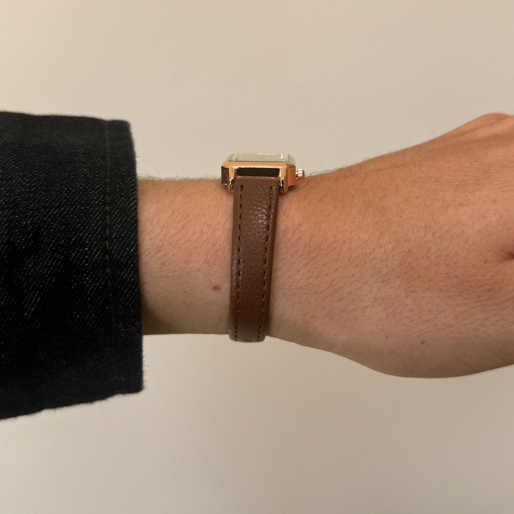 2000s vintage style rectangular gold luxury watch with leather band