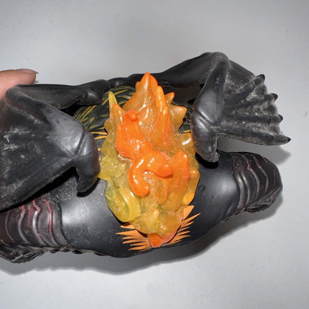 bobblehead demon with fire rope