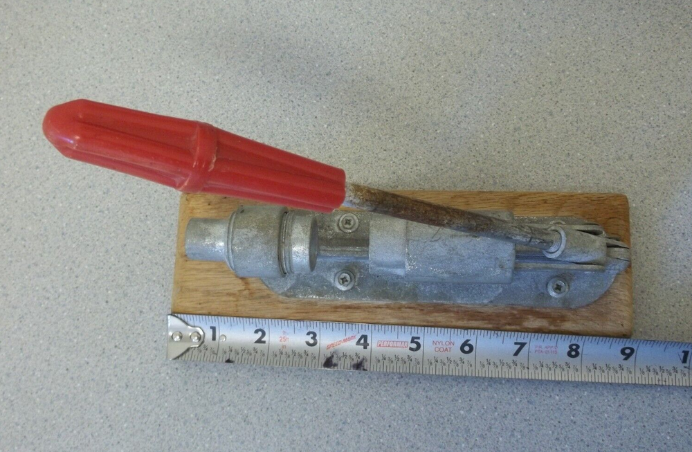 Nutcracker with red handle knob on wooden base Vintage adjustable nutcracker