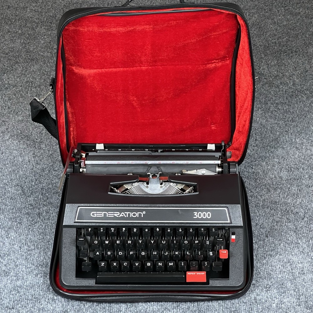 Generation 3000 Manual Typewriter with Case and Paperwork