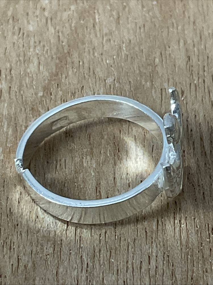 An elegant and modern silver ring featuring the goddess, Isis. Adjustable