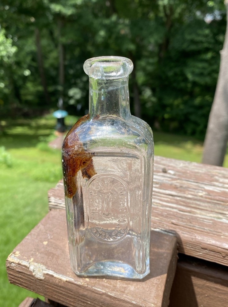 The Singer Sewing Machine Co Bottle