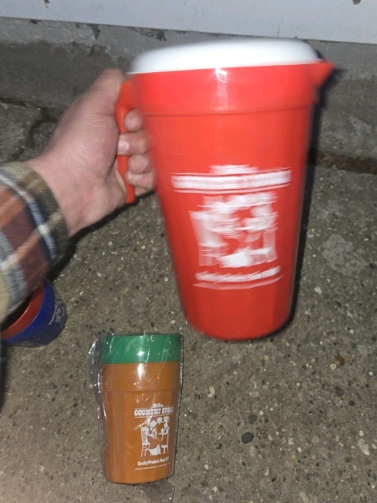 McNess Country Store. Plastic Pitcher And 4 Plastic Cups
