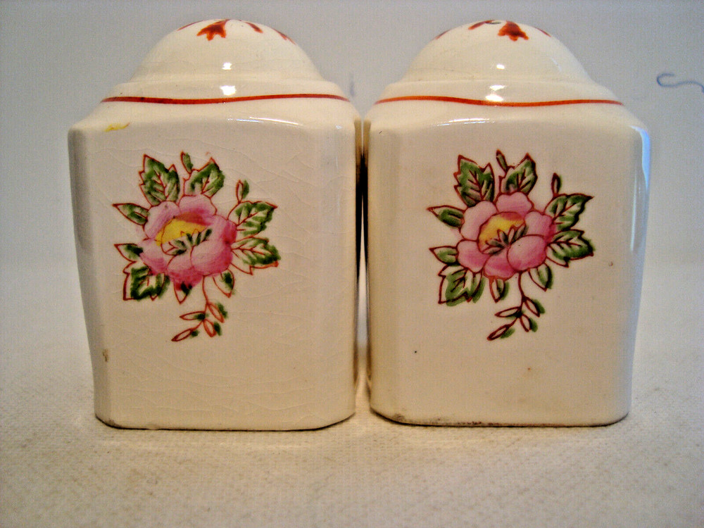 Hand painted white porcelain salt & pepper shaker set.