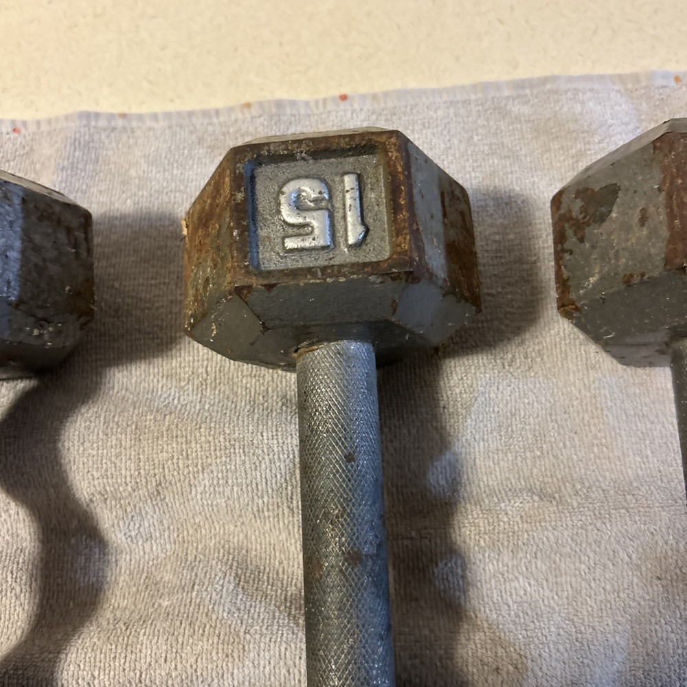 Three 15 Pound hex Head Cast Iron Dumbbells Silver