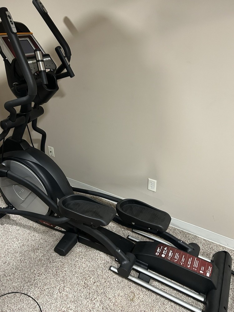 Sole E35 elliptical machine, featuring its digital display panel, dual handlebar