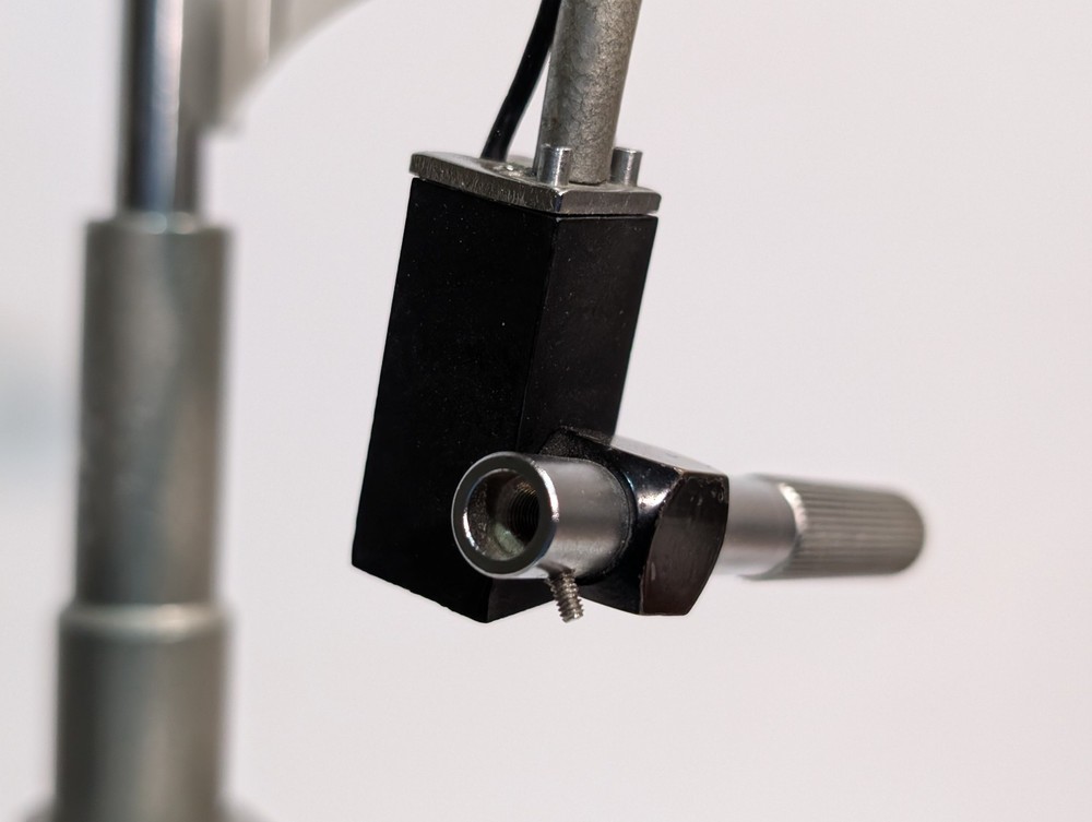 Optometry patient eye exam chin head rest and forehead bracket mount assembly