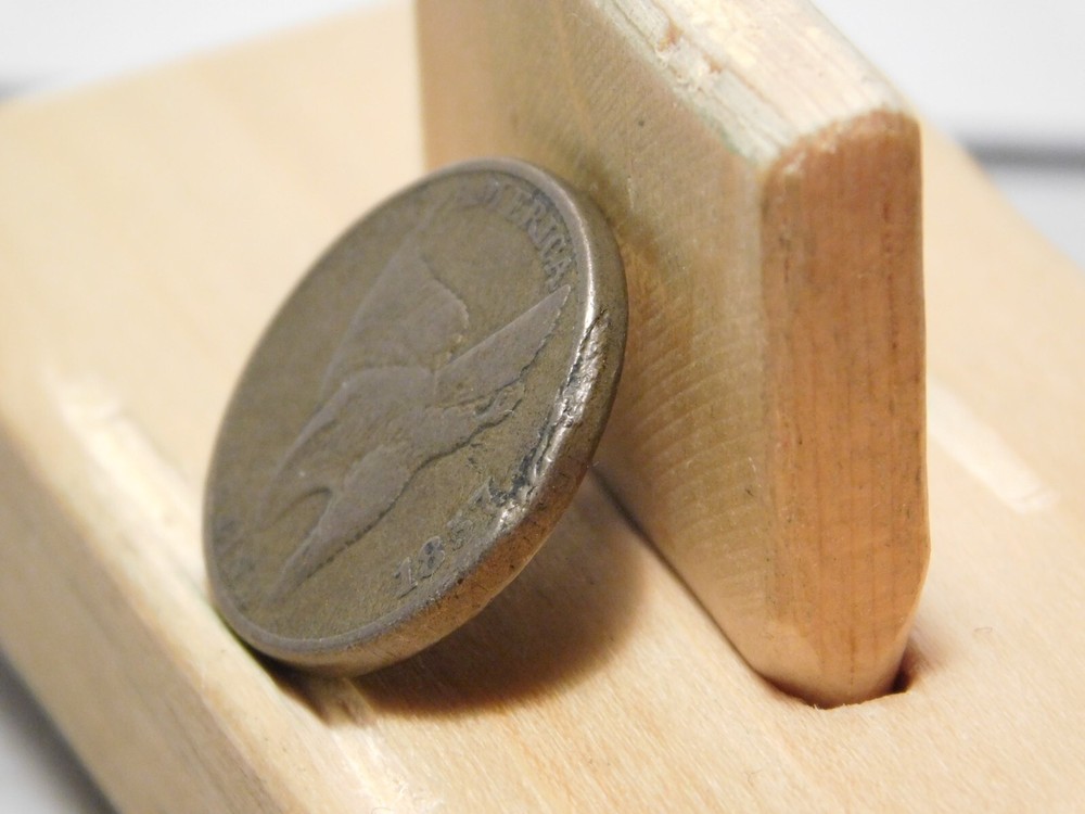 1857 U.S. Flying Eagle cent, lamination error at edge