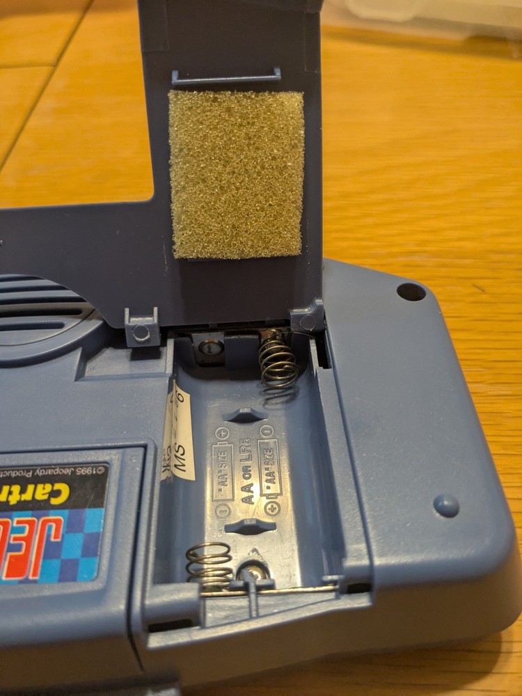 Tiger Electronics Jeopardy Hand Held Game 1995 with Answer Question Book