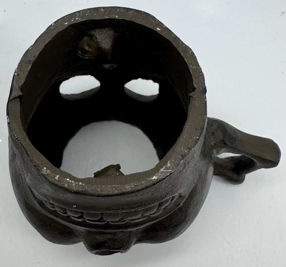 Cast Iron Skull-Shaped Bottomless Mug Thingy With Handle Both Ends And Eyes Open