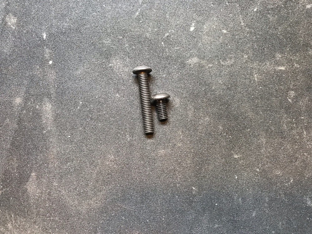 Autococker hinge frame screws