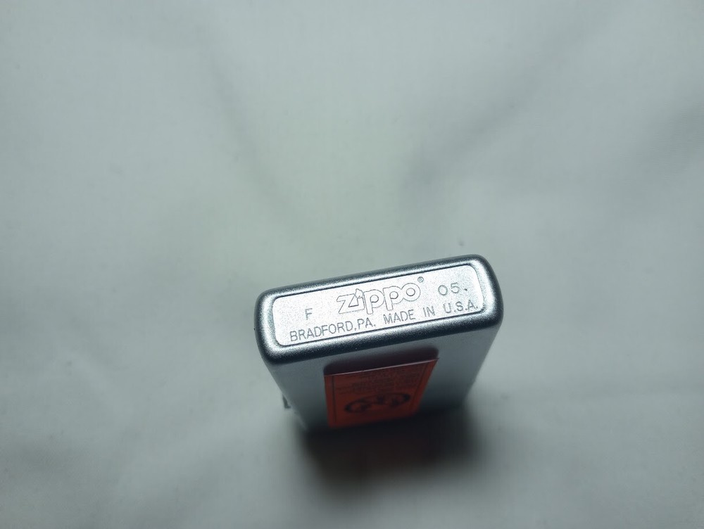 ---New unfired 2005 Zippo DWM monogram engraved lighter