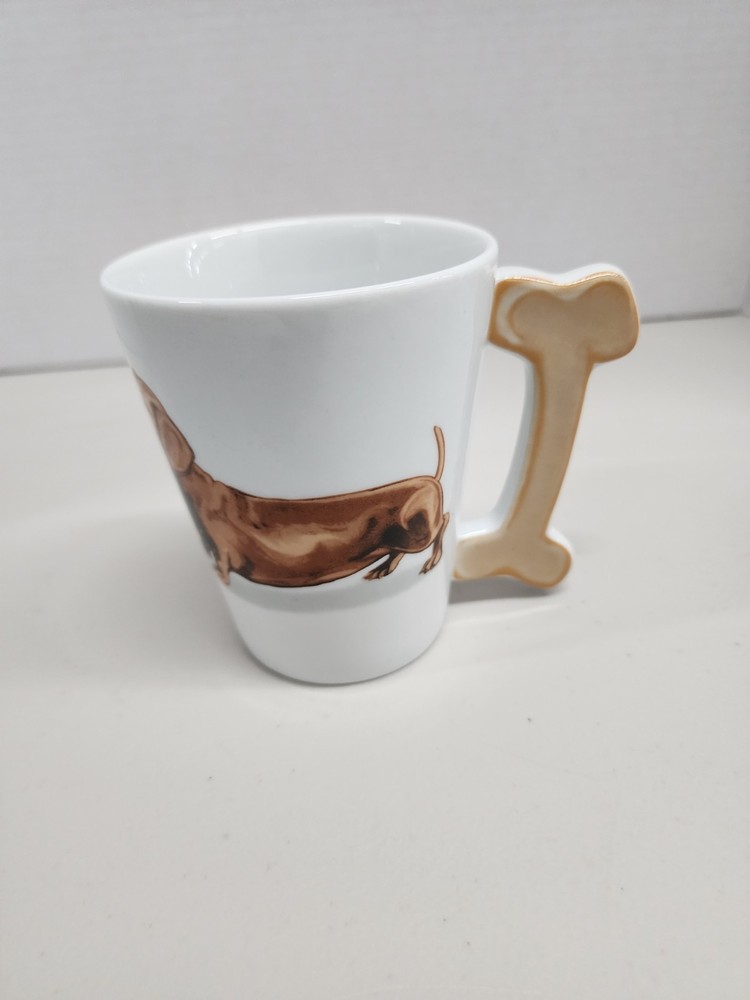white ceramic mug featuring a brown dachshund design with a distinctive dog