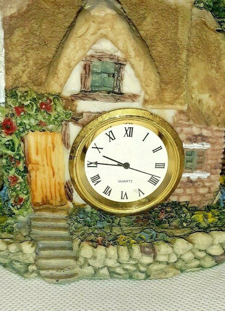 RESIN COTTAGE HOME WITH A QUARTZ CLOCK