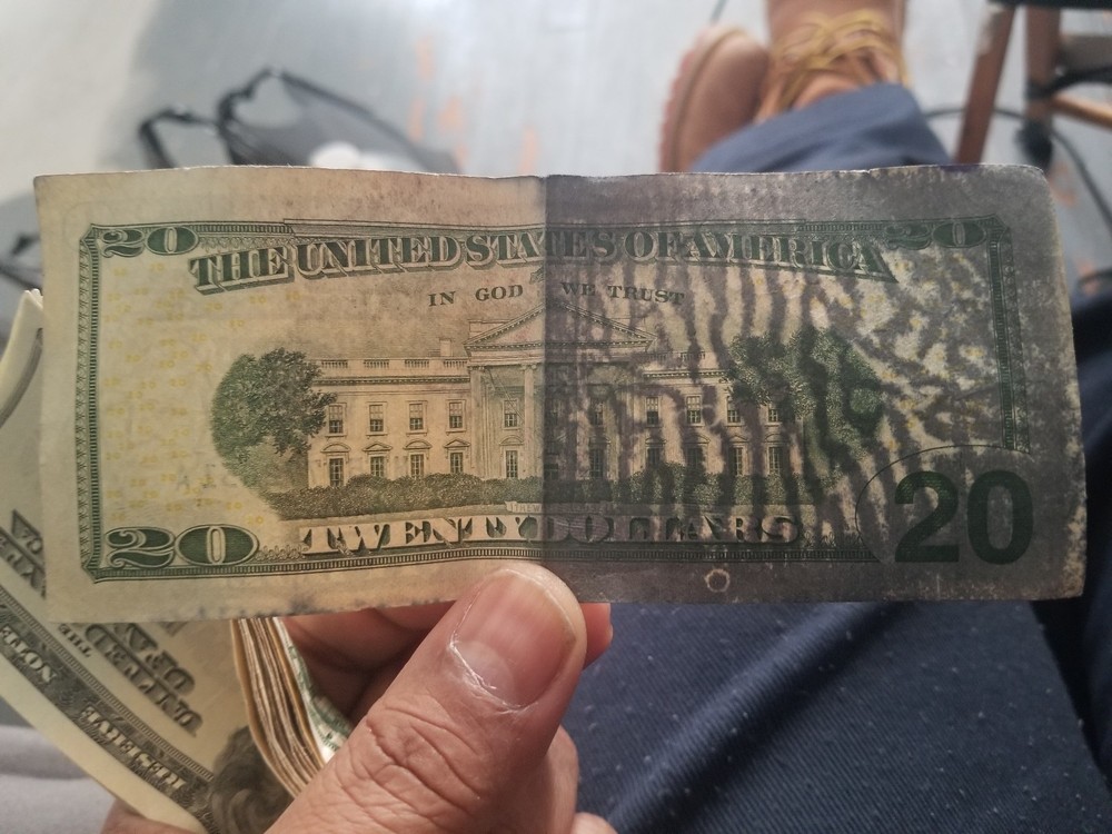 20 Dollar error print over fold