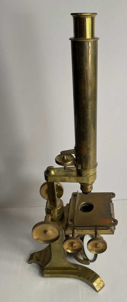 Antique Signed J.H. Steward microscope with case and some accessories.