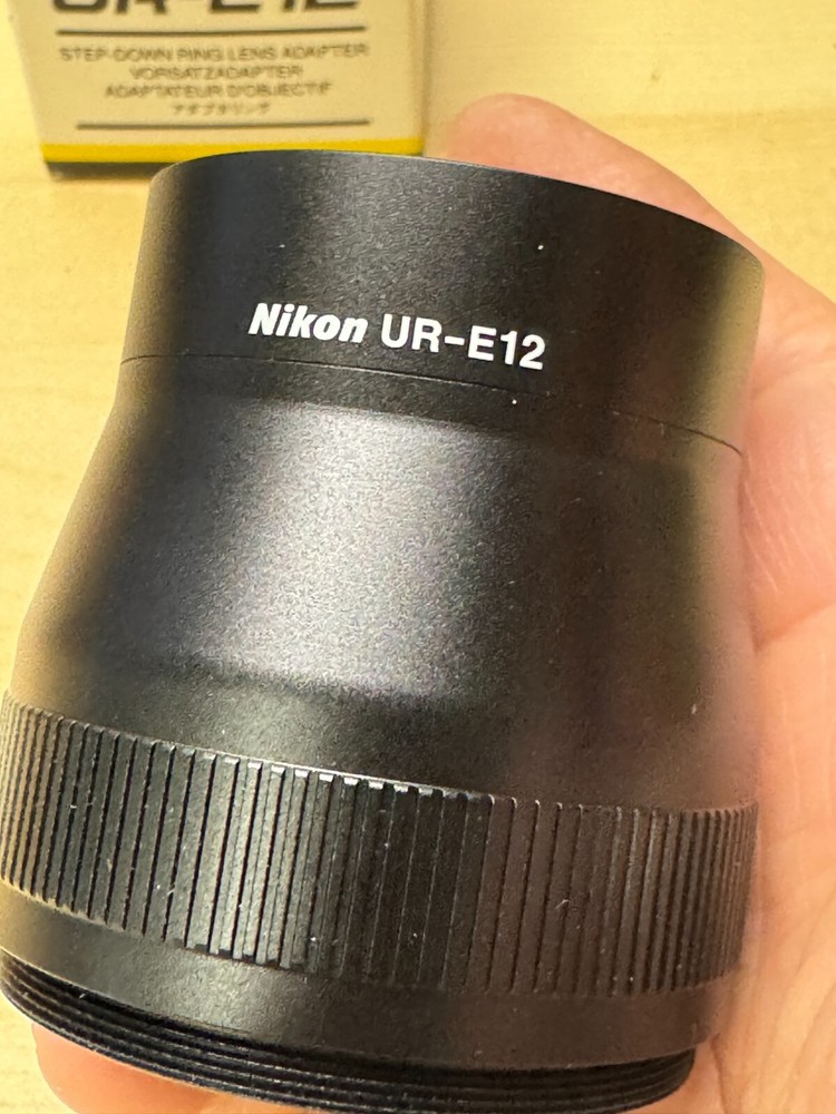 New in Box Nikon UR-E12 Step Down Ring Lens Adapter (AF43)