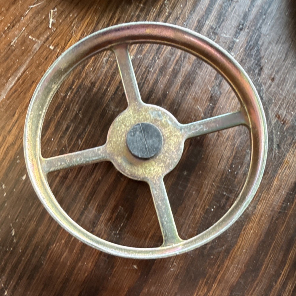 Rotating disk scrapper for John Deere or white planters