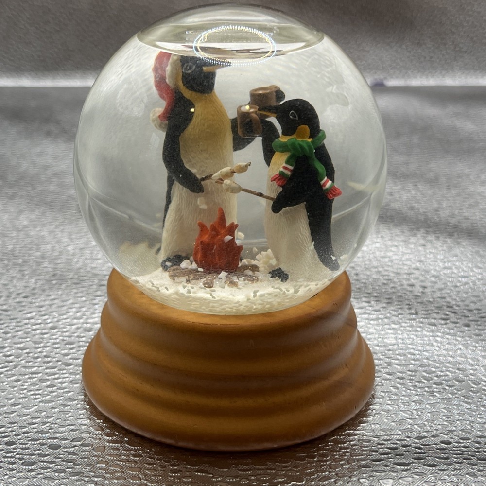 Eddie Bauer Penguin Snow globe 2002 Open Fire Roasting Marshmallows