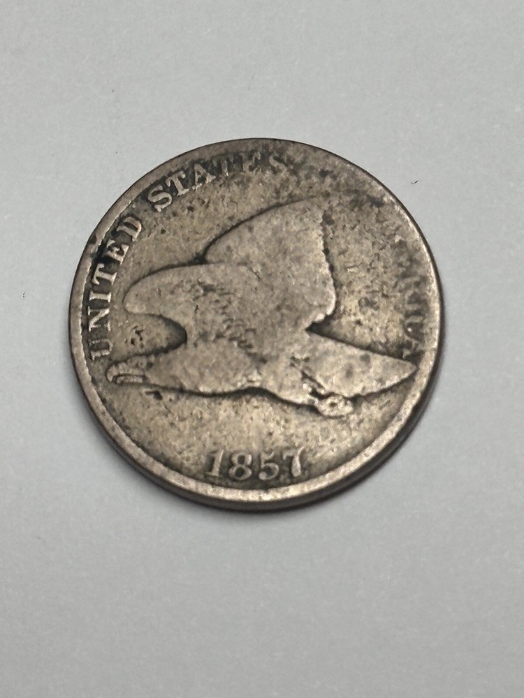 1857 Flying Eagle Cent about good.