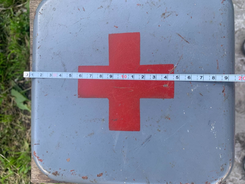 Old Soviet first aid kit with military equipment.