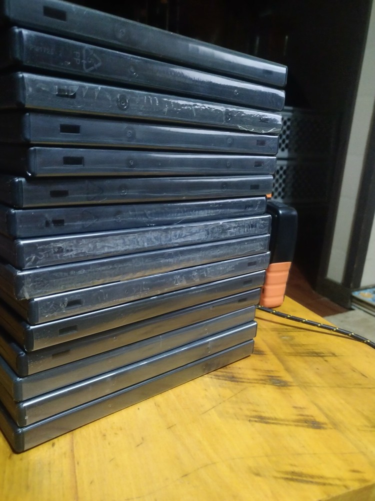 15 Empty DVD Cases - plastic covers are still intact.