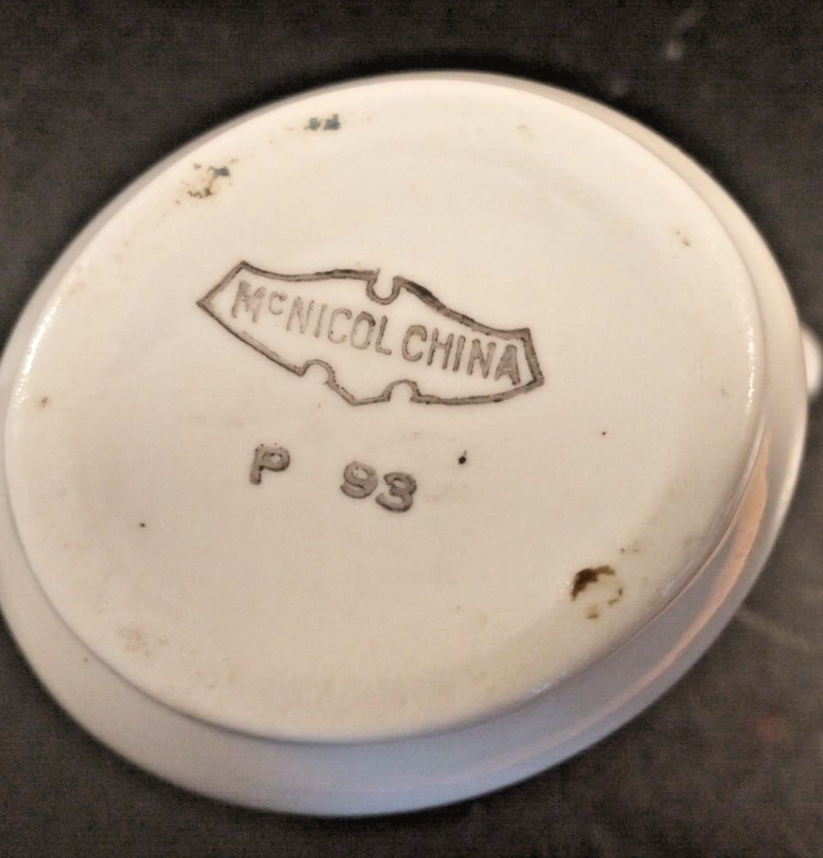 McNicol small creamer with glaze damage on handle