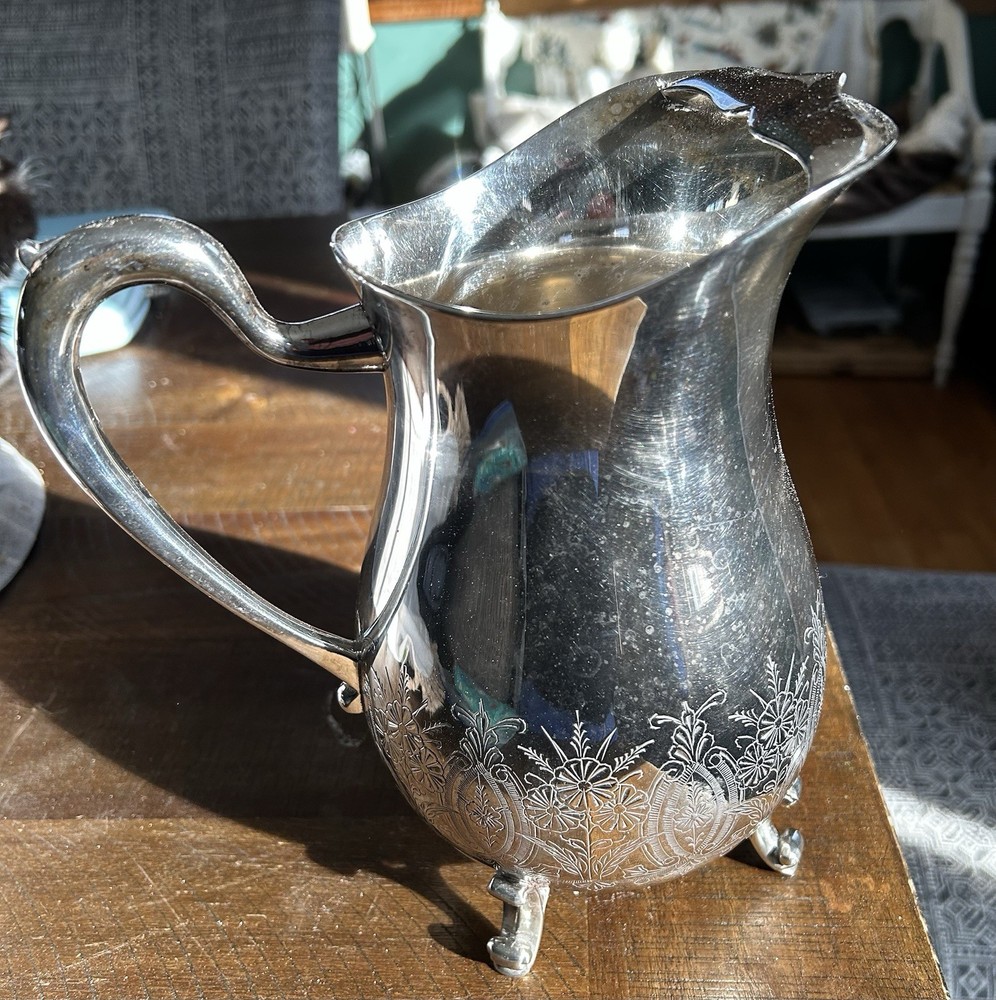 Vintage Leonard silver-plated pitcher with engraved floral pattern.