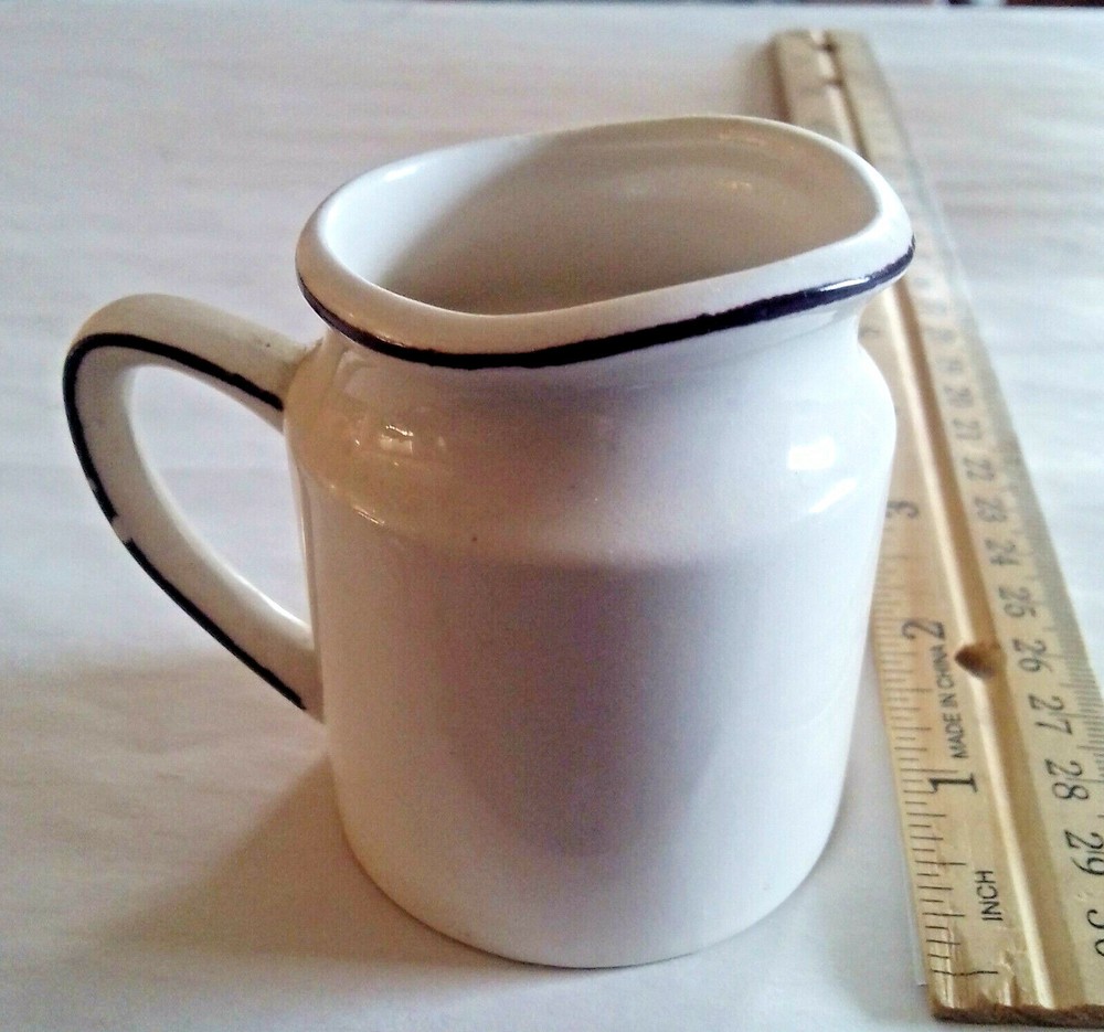 Porcelain Creamer 1/2 Cup marked on Bottom.