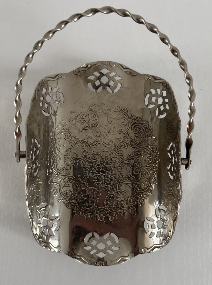Silvertone metal basket handle w cut outs.