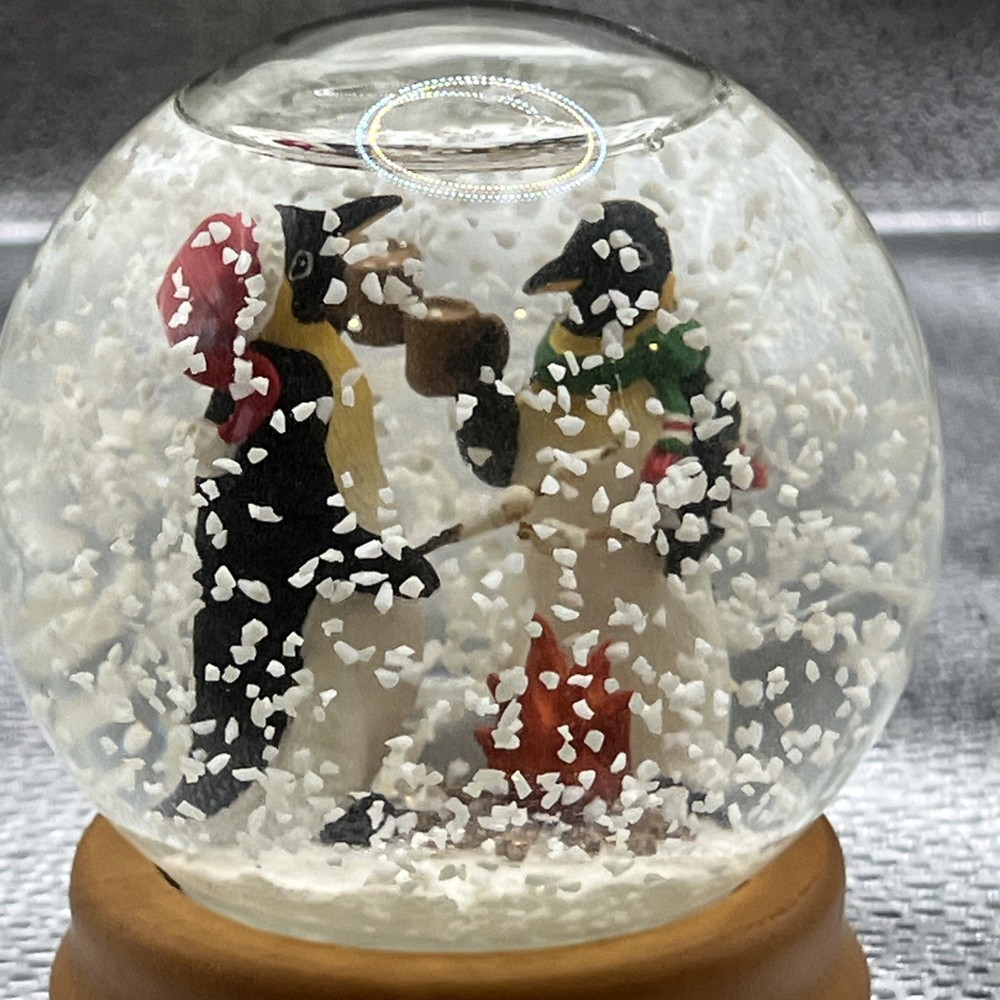 Eddie Bauer Penguin Snow globe 2002 Open Fire Roasting Marshmallows