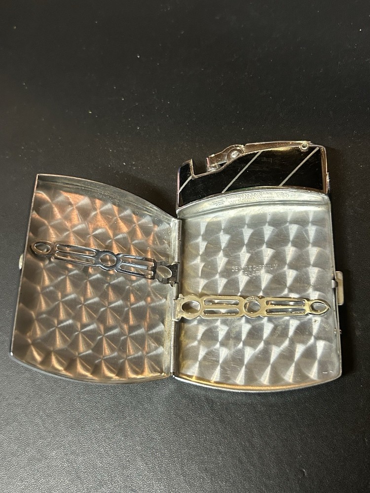 Vintage Ronson Tuxedo combination cigarette case and lighter.