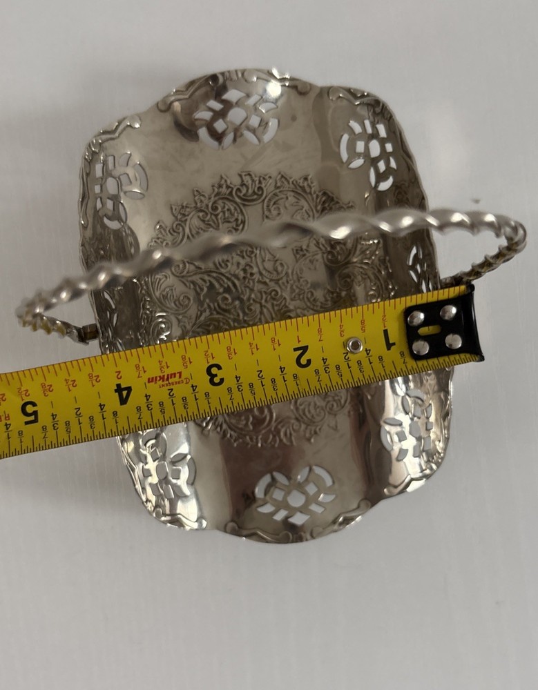 Silvertone metal basket handle w cut outs.
