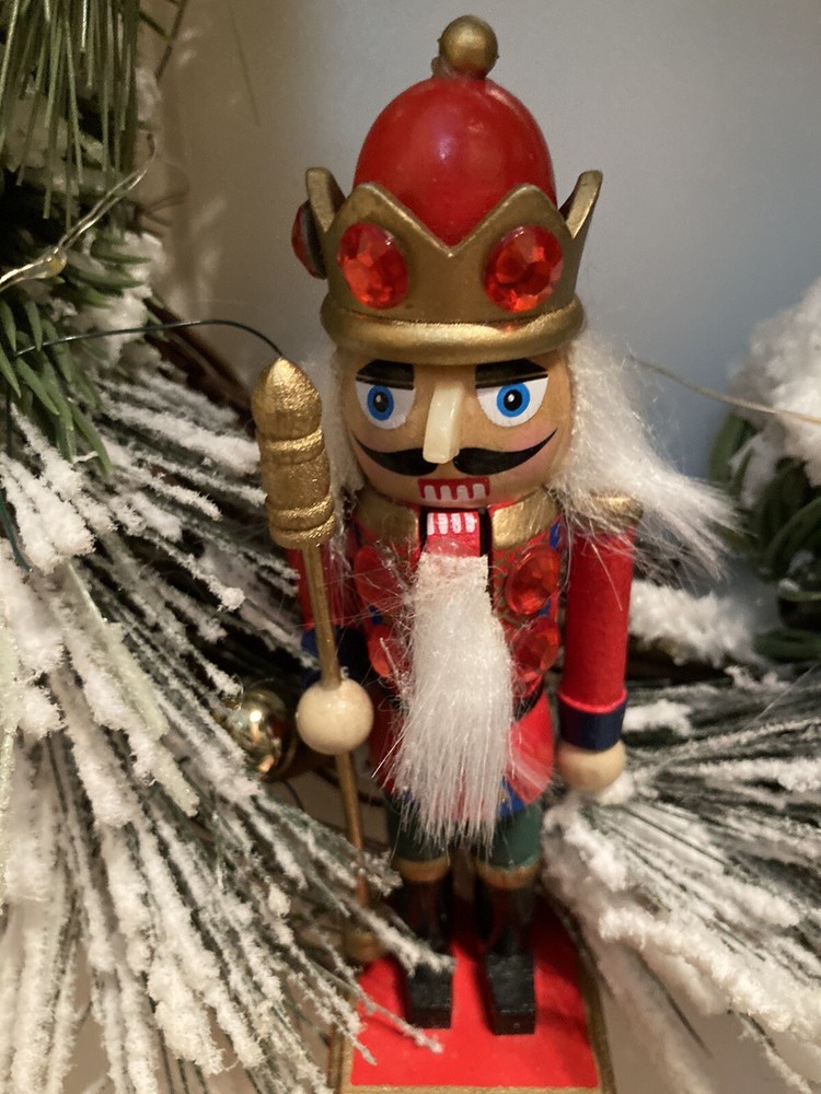 The Nutcracker Wreath With A Red And Green Ribbon