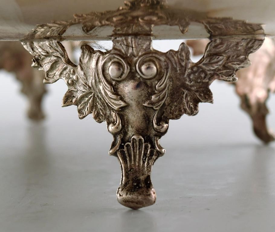Large silver bowl pierced with grape vines.
