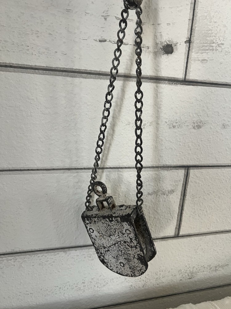Vintage industrial cast iron hook and chain assembly