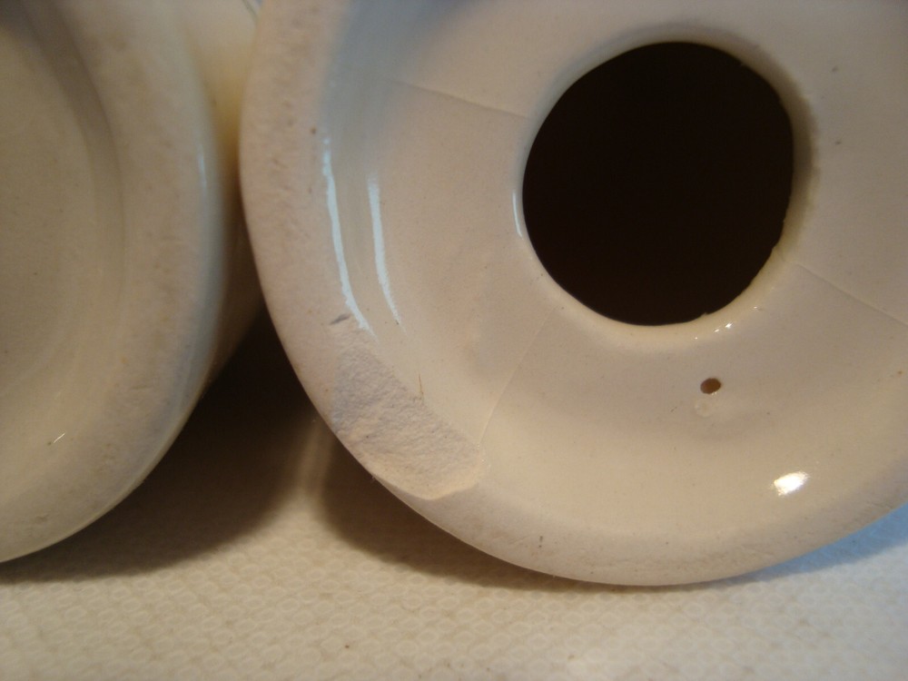 Cone shape white porcelain salt & pepper set.