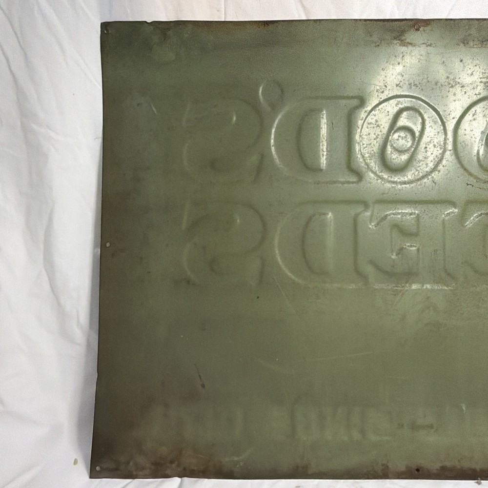 Woods Seeds Embossed Tin Sign