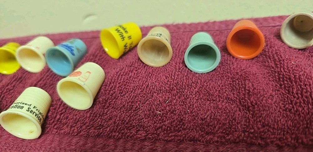 17 Plastic Thimbles 15 Have Advertising On Them