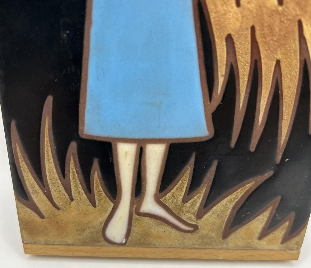 Girl holding wheat tile signed