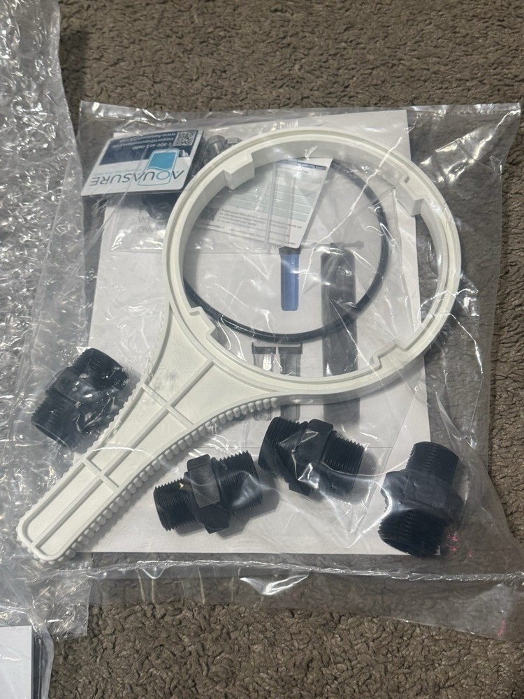 AQUASURE REPLACMENT FILTER CANSITER AND MOUNTING BRACKET AND HOSE TOOLS ETC.