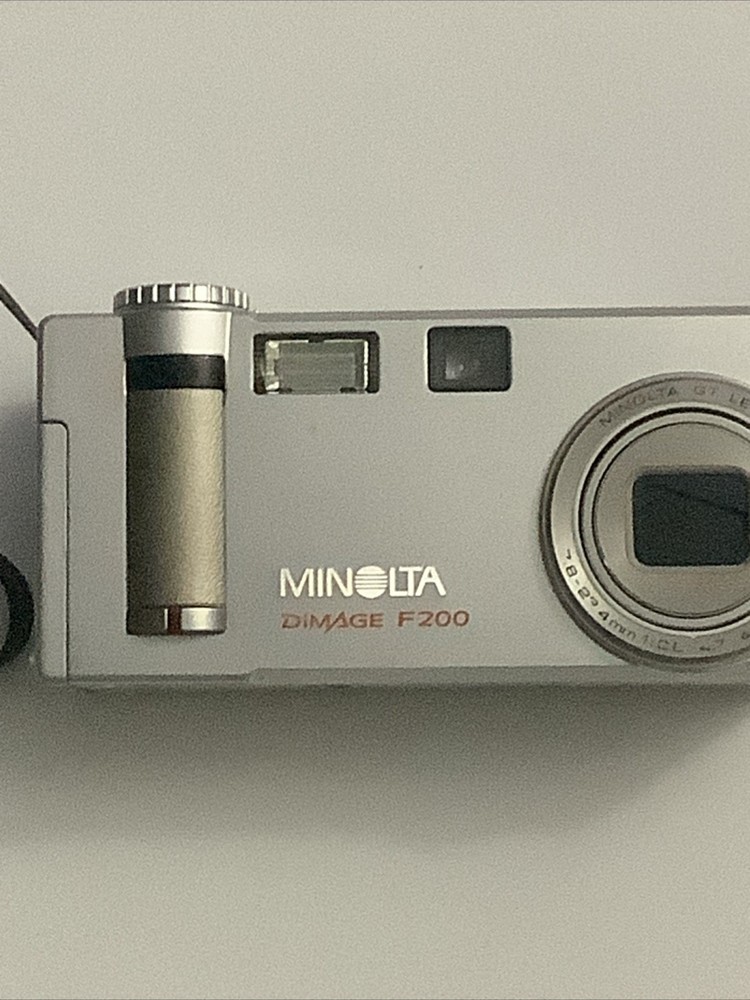 Minolta Konica DiMAGE F200 4.0MP Digital Camera - Silver - Powers On - Read